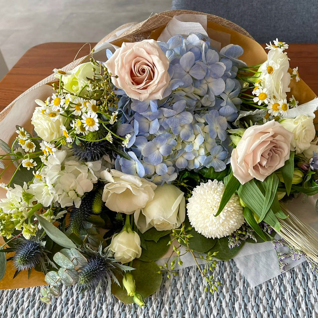 graduation flower bouquet with roses and hydrangeas