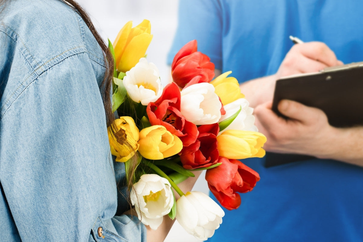 woman receiving same day flower delivery 